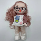 Doll with pink hair, glasses, and a white dress on a light gray background